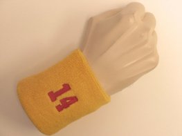 Golden yellow wristband sweatband with number 14