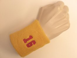 Golden yellow wristband sweatband with number 16