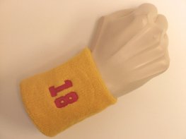 Golden yellow wristband sweatband with number 18