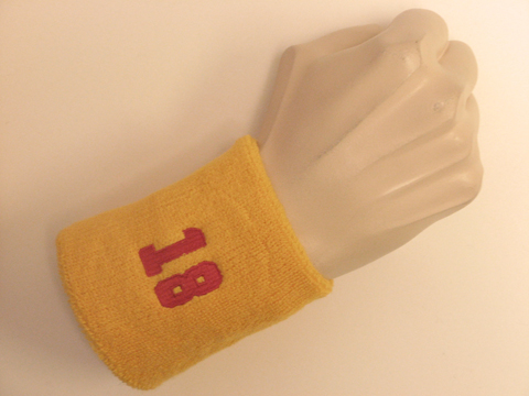 Golden yellow wristband sweatband with number 18