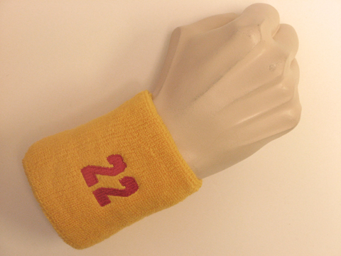 Golden yellow wristband sweatband with number 22